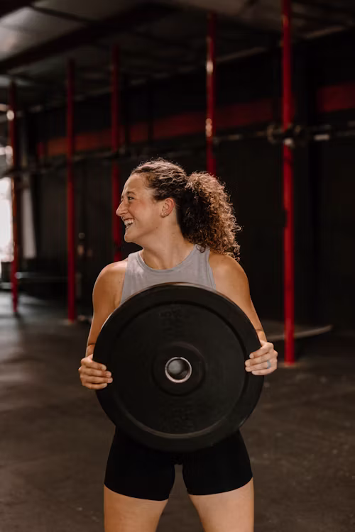Founder and coach Aoife standing confidently in the studio